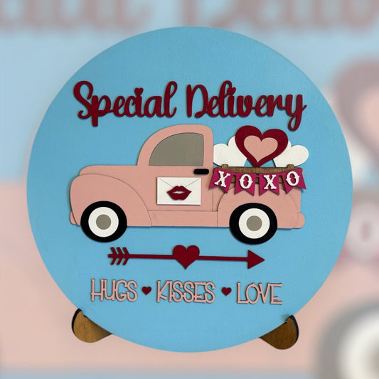 Valentine's Day-themed pink truck with hearts and text on a blue background