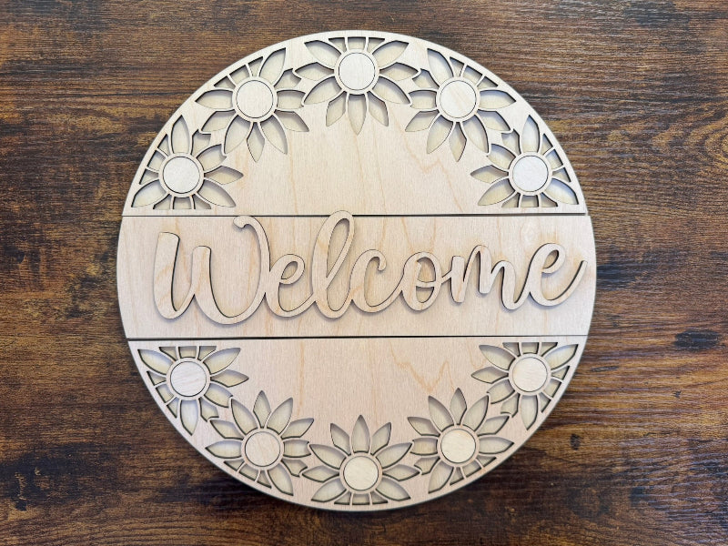 Wooden welcome sign with sunflowers